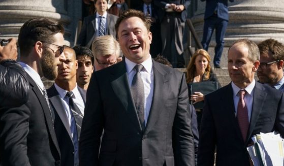 Tesla CEO Elon Musk, pictured in a file photo from 2019, has been openly mocking attacks against him as politically driven. But in a Twitter post Thursday, he reaffirmed his commitment to free speech.