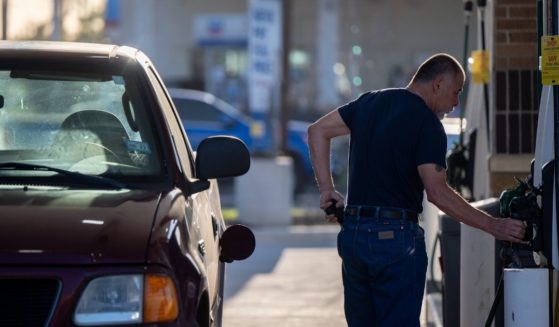 A man pumps gas at a Shell gas station on April 1 in Houston.