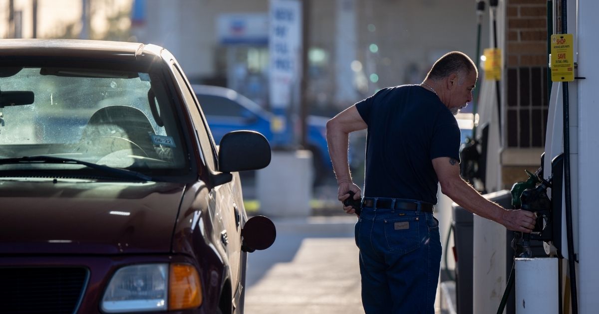 A man pumps gas at a Shell gas station on April 1 in Houston.