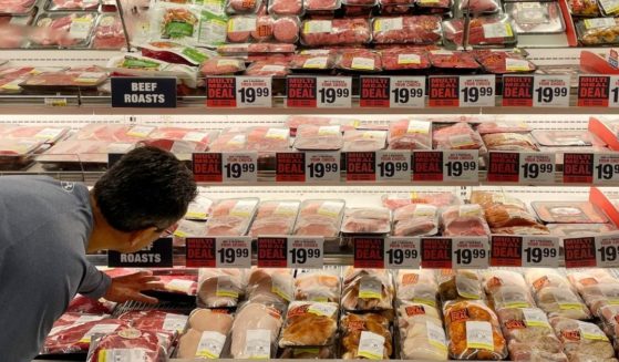 A man shops for meat at a Safeway grocery store in Annapolis, Maryland, on Monday.