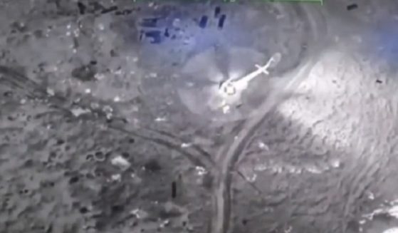 A Russian militlary helicopter is pictured in footage released by the Ukraine military just before it was destroyed by a drone strike.