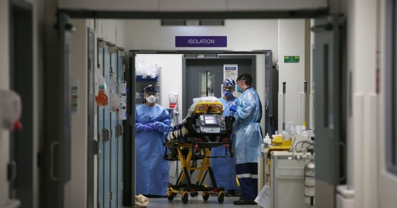 A suspected COVID-19 patient is taken into an isolation ward at St Vincent's Hospital on June 4, 2020, in Sydney, Australia.