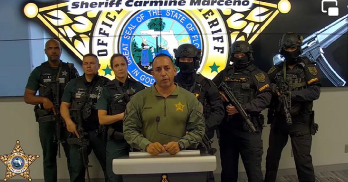 Lee County, Florida, Sheriff Carmine Marceno surrounded by sheriff's deputies.