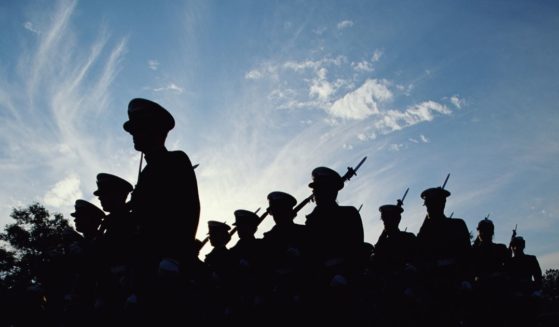 Soldiers march in this stock image.