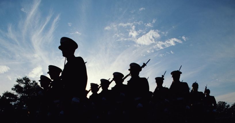 Soldiers march in this stock image.