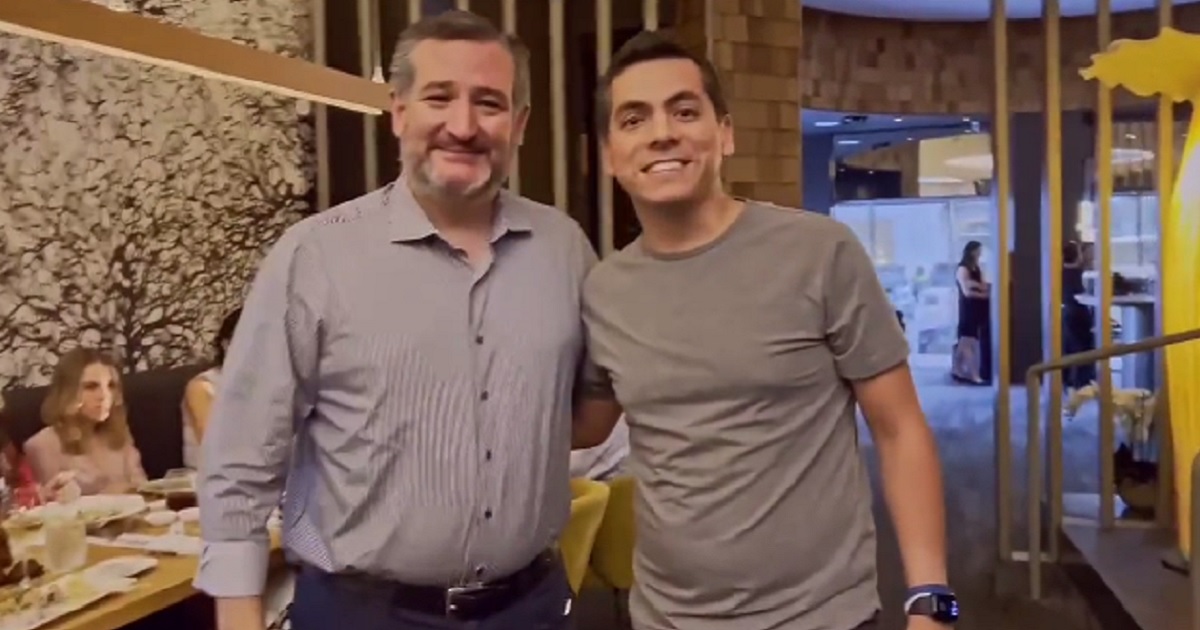 Texas Sen. Ted Cruz poses for a picture Friday with a man who turned out to be a leftist activist.