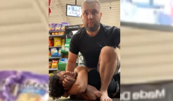 A jiujitsu instructor puts a hold a man who raised a disturbance in a Chicago 7-Eleven.