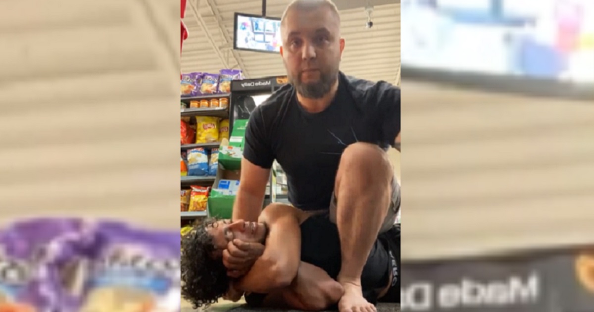 A jiujitsu instructor puts a hold a man who raised a disturbance in a Chicago 7-Eleven.