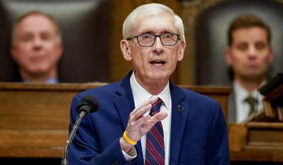 Wisconsin Gov. Tony Evers addresses a joint session of the Legislature in the Assembly chambers in Madison, Wis., in February.. Wisconsin's Supreme Court ruled Wednesday that political appointees don't have to leave their posts until the Senate confirms their successor.