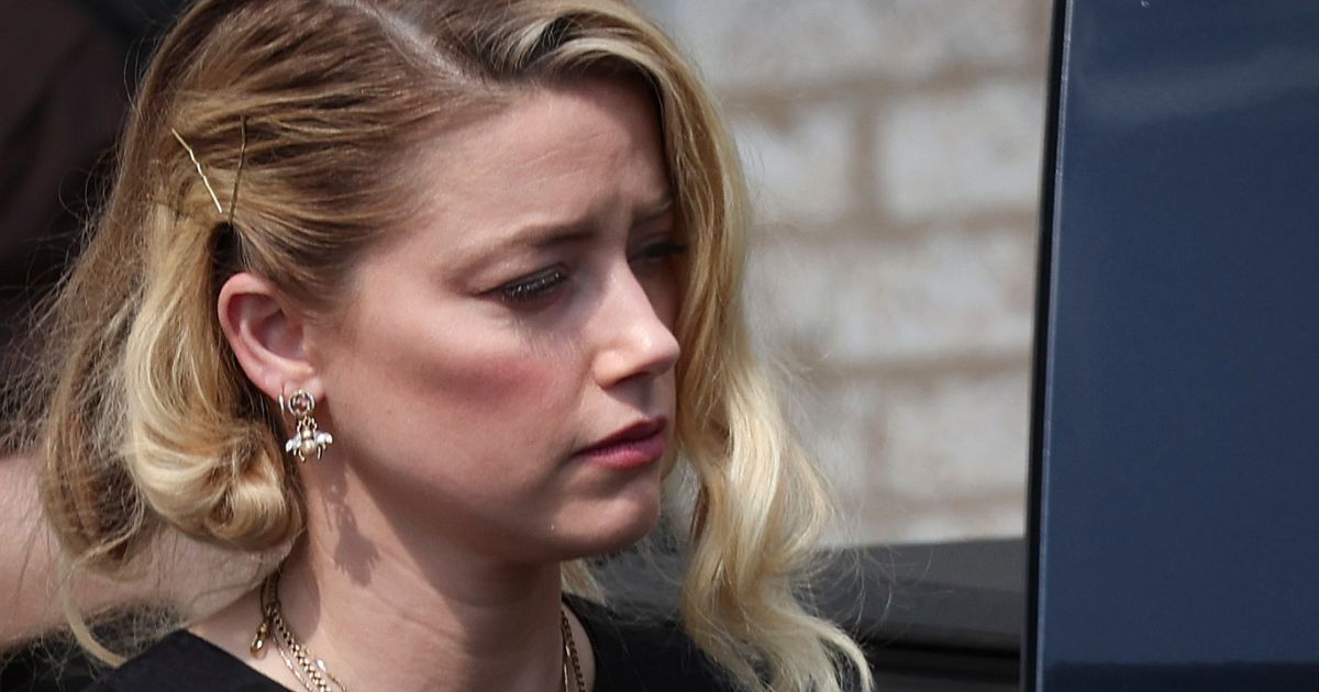 On Wednesday, actress Amber Heard leaves the Fairfax County Courthouse in Fairfax, Virginia, after hearing the verdicts in the suit against her from her ex-husband, actor Johnny Depp, and her countersuit against Depp.