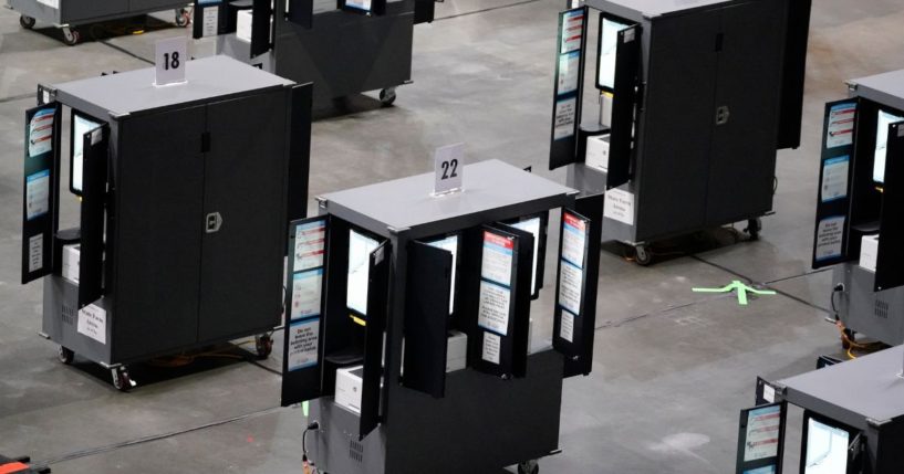 Dominion voting machines fill the State Farm Arena in Atlanta, for early voting on Oct. 12, 2020.