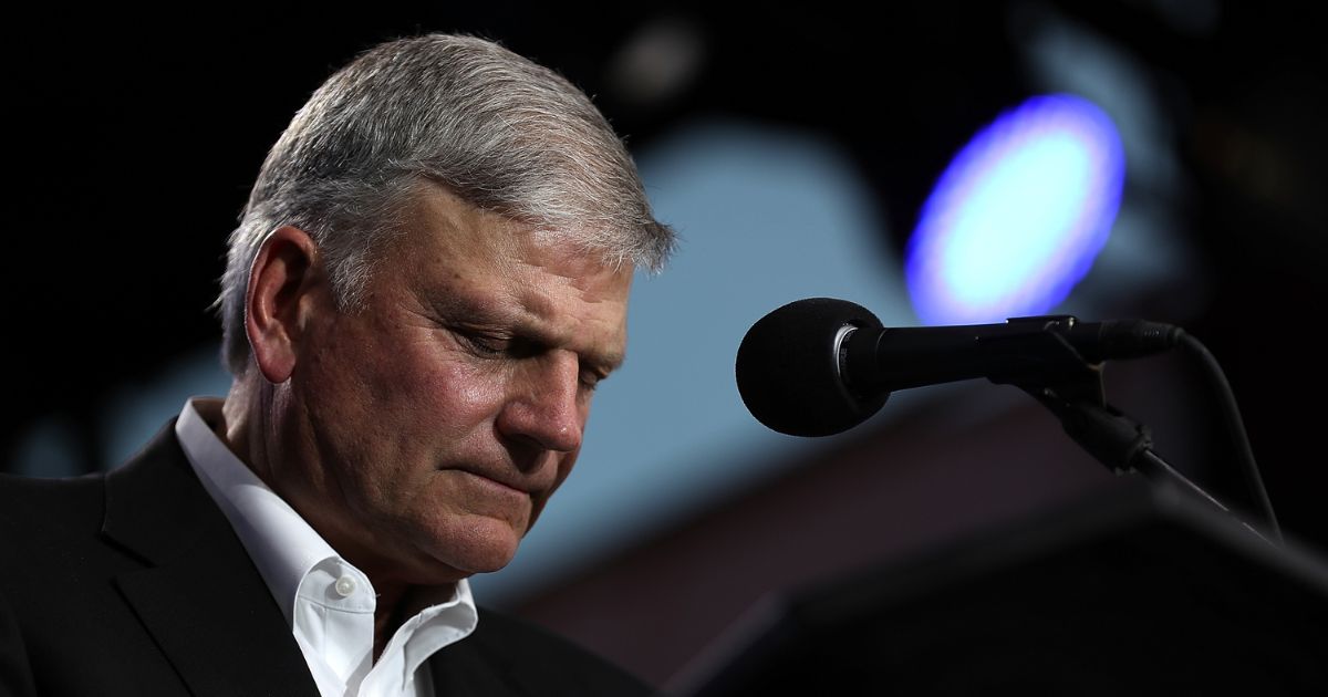 Rev. Franklin Graham prays during the "Decision America" tour at the Stanislaus County Fairgrounds in Turlock, California, on May 29, 2018.