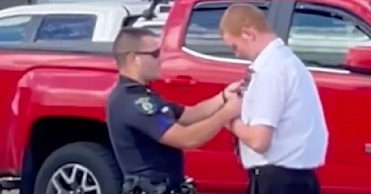 A Claremont police officer, Tyler Petrin, in New Hampshire stopped to help a young teen tie his tie before his graduation ceremony on June 9.
