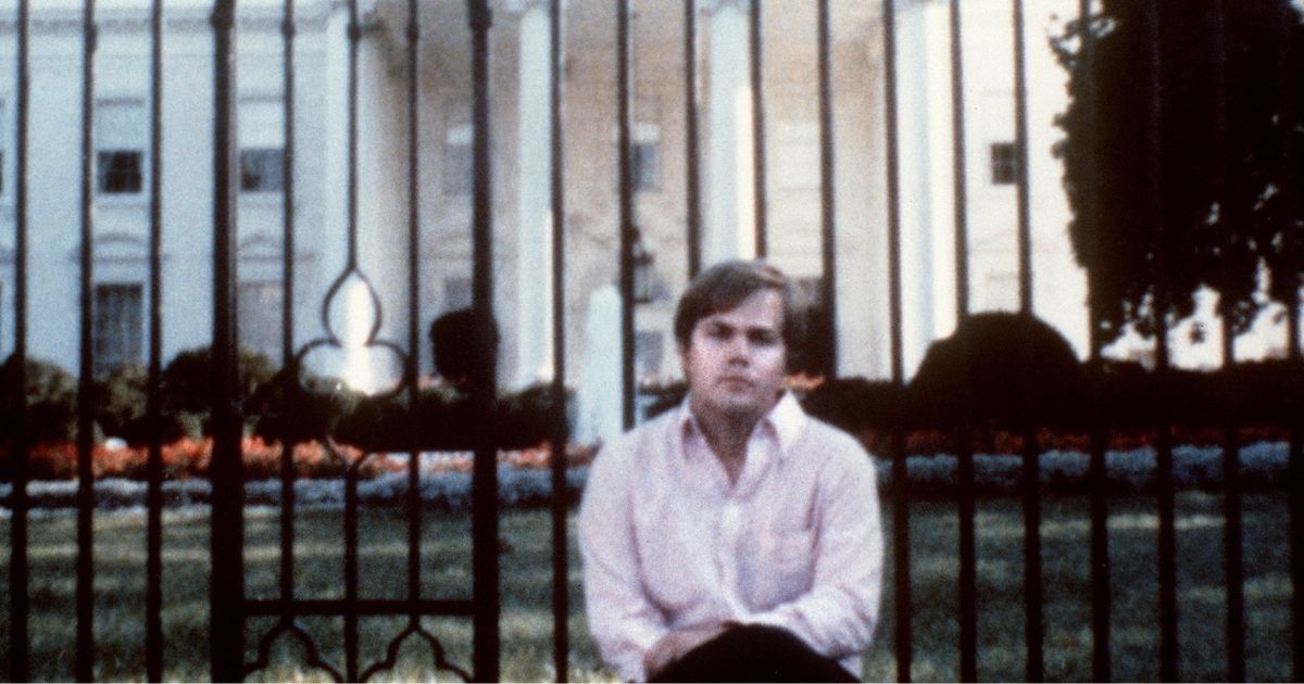 John Hinckley, who attempted to assassinate then-President Ronald Reagan on March 30, 1981, sits outside the White House.