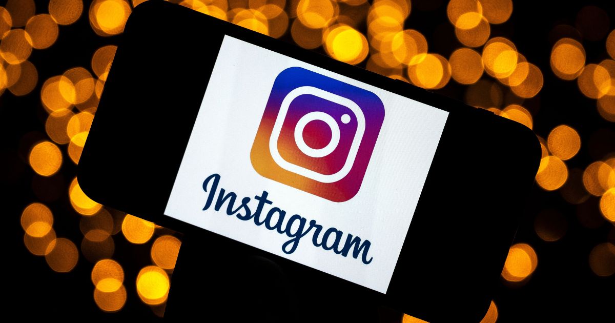 The logo for Instagram is displayed on a smartphone in Toulouse, France, on Sept. 28, 2020.