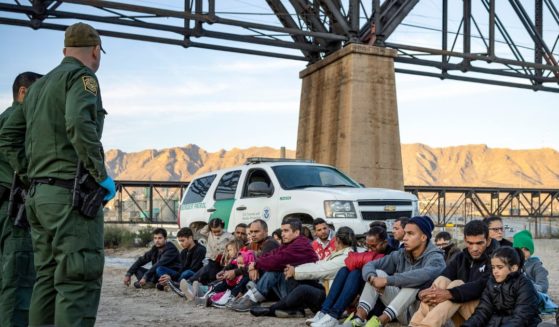 A group of about 30 immigrants that illegally crossed the border from Mexico into the U.S. are detained by U.S. Border Patrol agents.