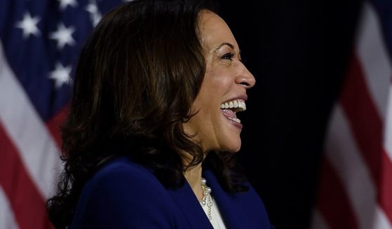 Then-Sen. Kamala Harris listens to then-presidential nominee Joe Biden speak during their first news conference together in Wilmington, Delaware, on Aug. 12, 2020.
