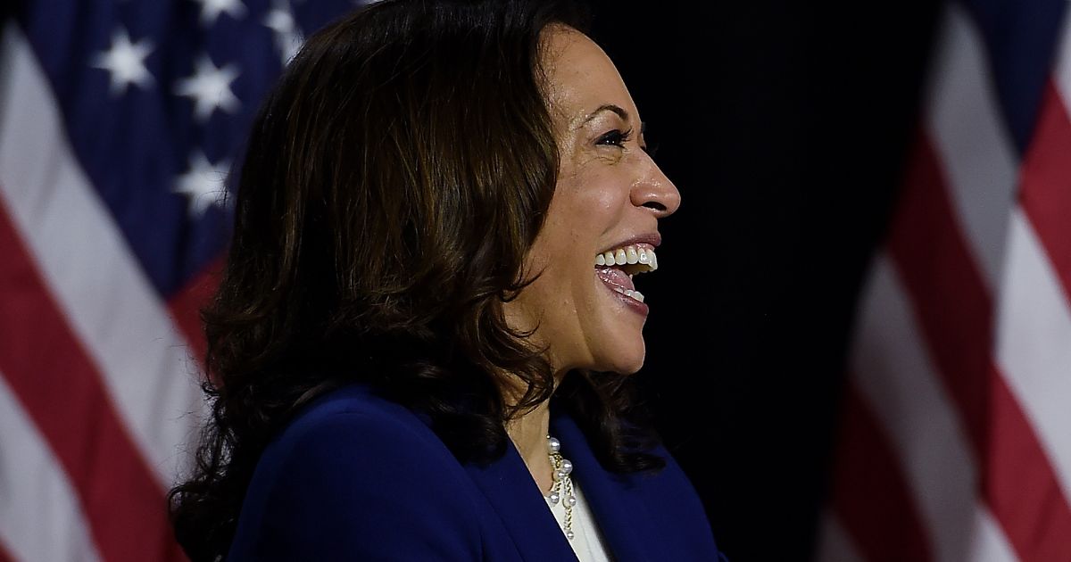 Then-Sen. Kamala Harris listens to then-presidential nominee Joe Biden speak during their first news conference together in Wilmington, Delaware, on Aug. 12, 2020.