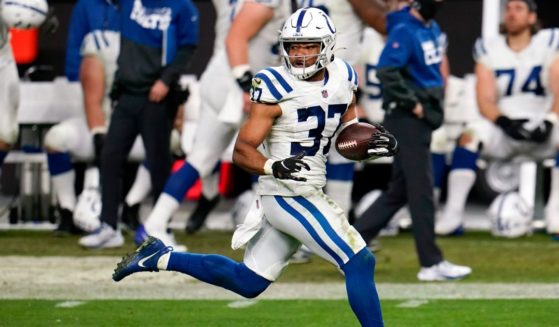 Indianapolis Colts safety Khari Willis returns an interception for a touchdown in an NFL football game, on Dec. 13, 2020.