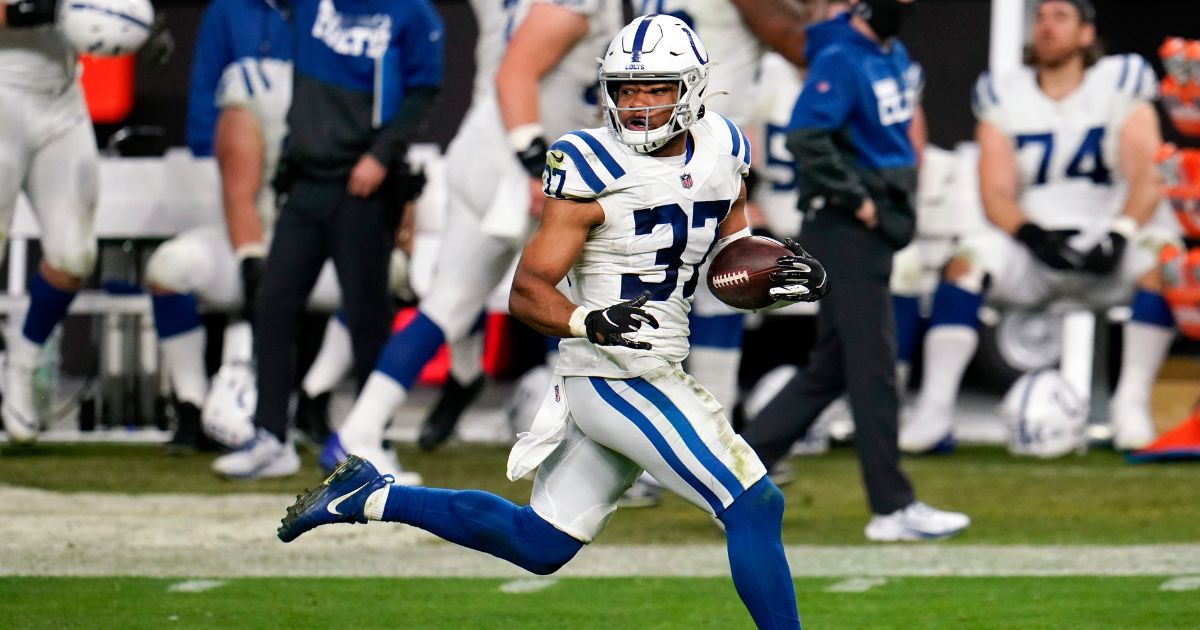 Indianapolis Colts safety Khari Willis returns an interception for a touchdown in an NFL football game, on Dec. 13, 2020.