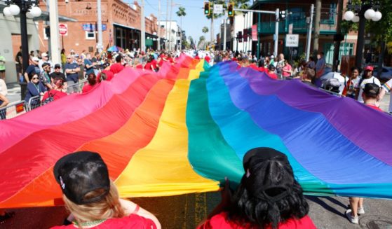Marchers participate in the Pride Parade on March 26 in Tampa, Florida.