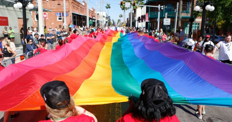 Marchers participate in the Pride Parade on March 26 in Tampa, Florida.