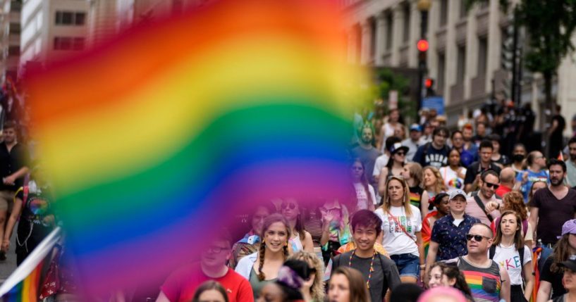 People participate in a parade celebrating the LGBT movement in downtown Washington, D.C., on June 12, 2021.