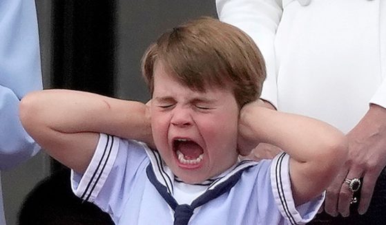 Queen Elizabeth II's great-grandson Prince Louis covers his ears during the Platinum Jubilee celebrations on the balcony of Buckingham Palace in London on Thursday.