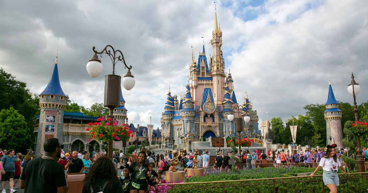 People visit the Magic Kingdom at Walt Disney World Resort in Lake Buena Vista, Florida, on April 22.