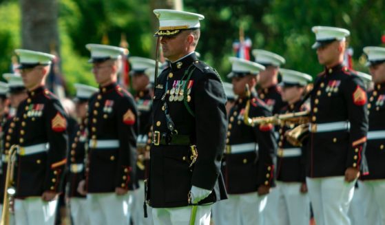 U.S. Marines from 6th Marine Regiment, 2nd Marine Division and the 2nd Marine Division Band stand in formation during a ceremony at Aisne-Marne American Cemetery in France marking the 104th anniversary of World War I's Battle of Belleau Wood on Sunday.