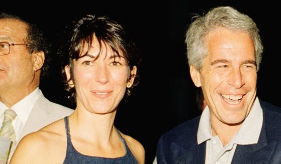 Ghislaine Maxwell, left, and Jeffrey Epstein, right, pose during a party at the Mar-a-Lago club, Palm Beach, Florida, February 12, 2000.
