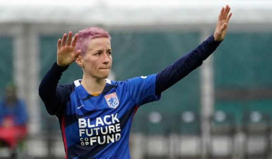 OL Reign forward Megan Rapinoe waves to fans after a loss