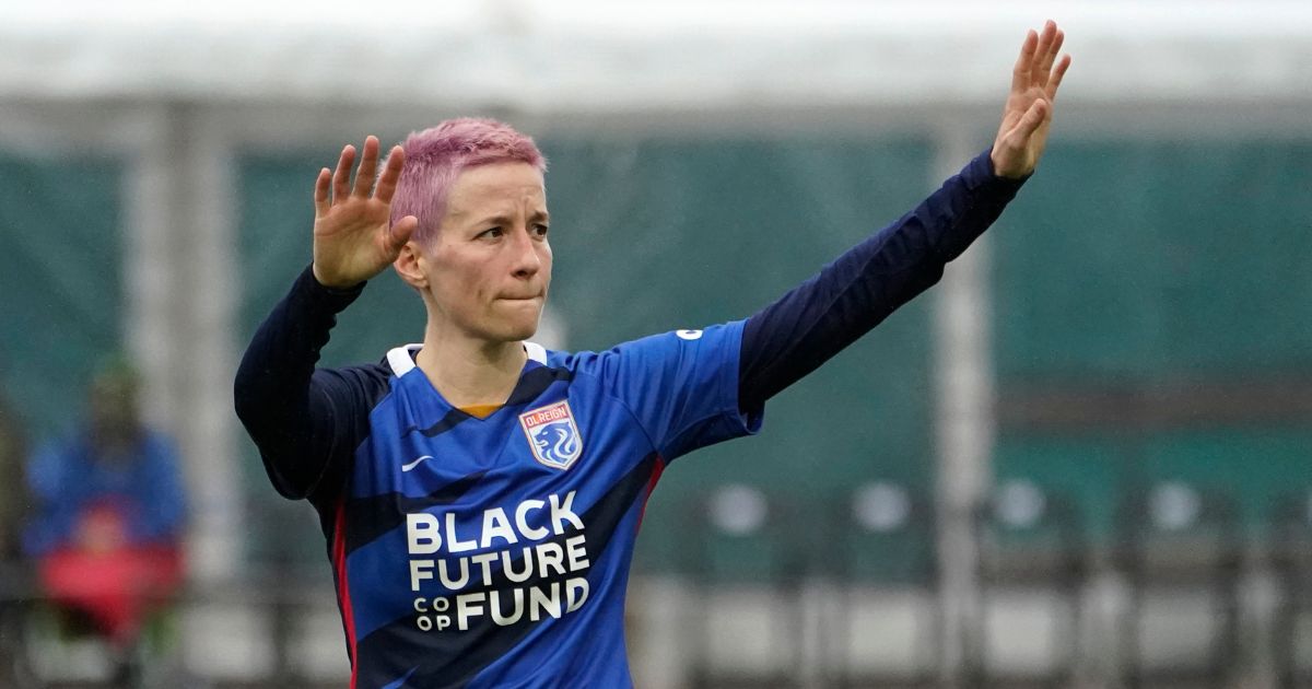 OL Reign forward Megan Rapinoe waves to fans after a loss