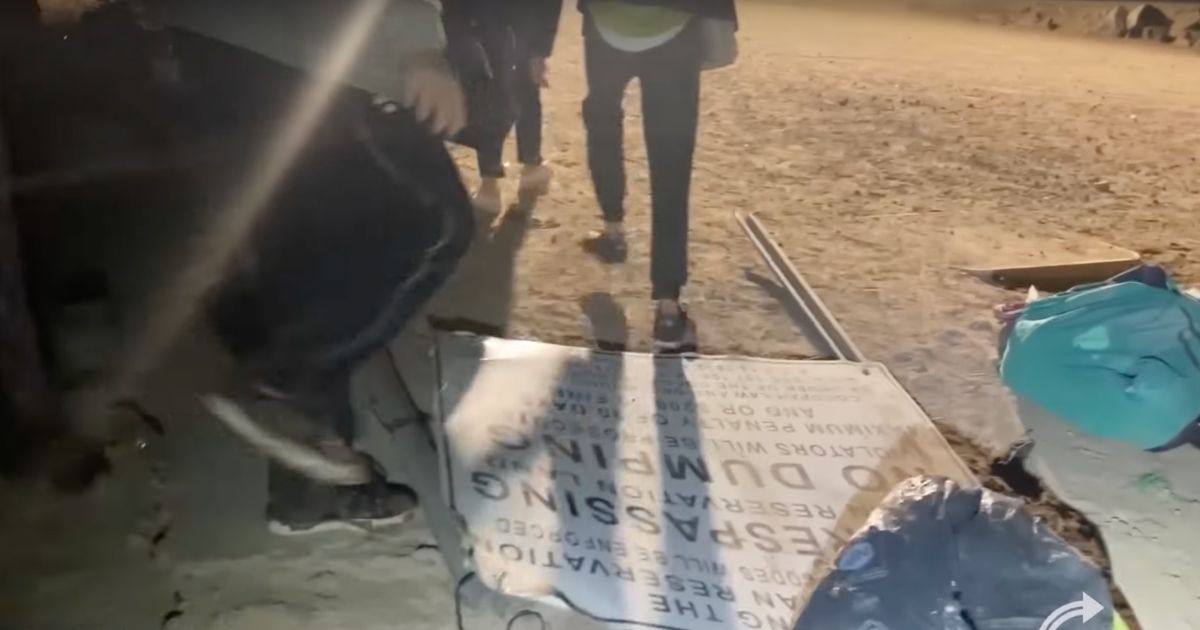 A video released by Turning Point USA shows illegal immigrants crossing into the United States by stepping on a "No Trespassing" sign.