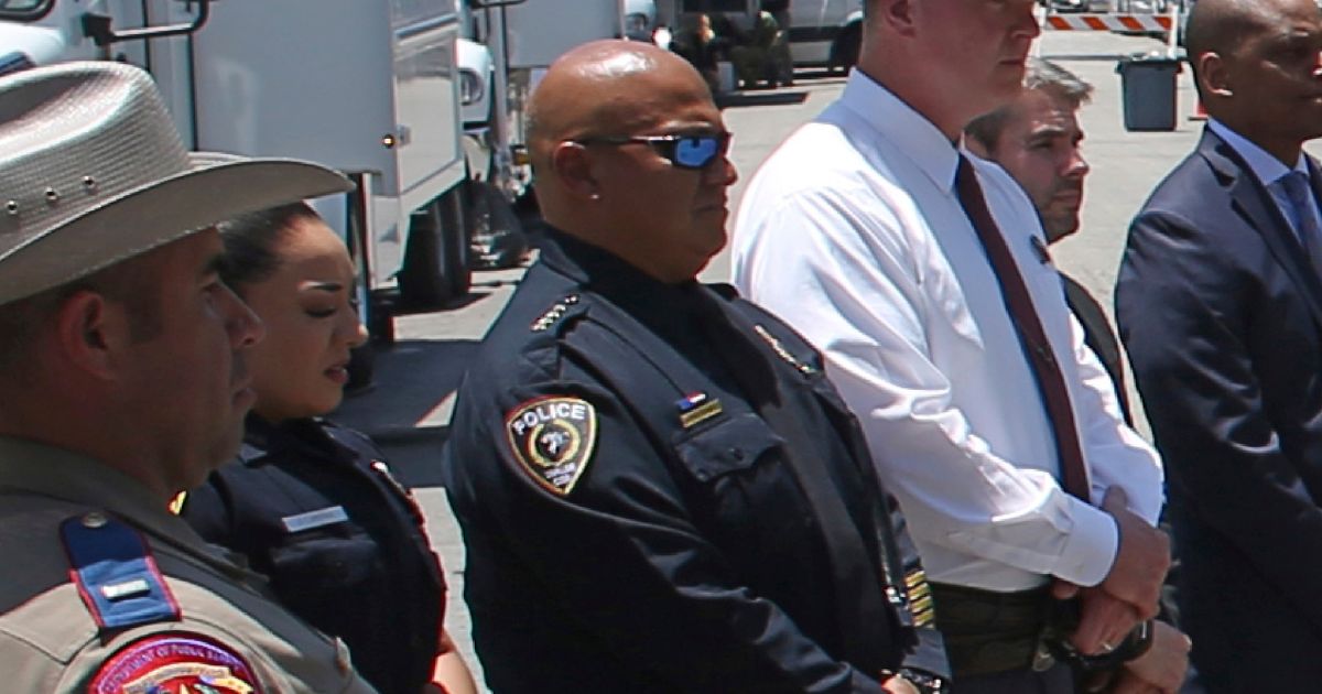 Then-Uvalde School Police Chief Pete Arredondo, third from left, stands during a news conference outside of the Robb Elementary school in Uvalde, Texas, on May 26.