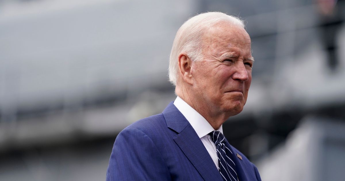 President Joe Biden waits before giving remarks on inflation and supply chain issues at the Port of Los Angeles on Friday in Los Angeles.