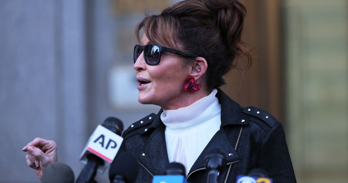 Former Republican Gov. Sarah Palin of Alaska speaks with reporters as she leaves federal court in New York City on Feb. 14.