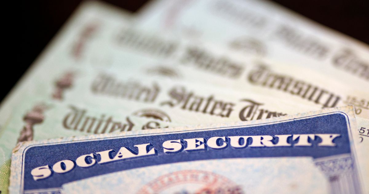 A Social Security card sits alongside checks from the U.S. Treasury on Oct. 14, 2021, in Washington, D.C.