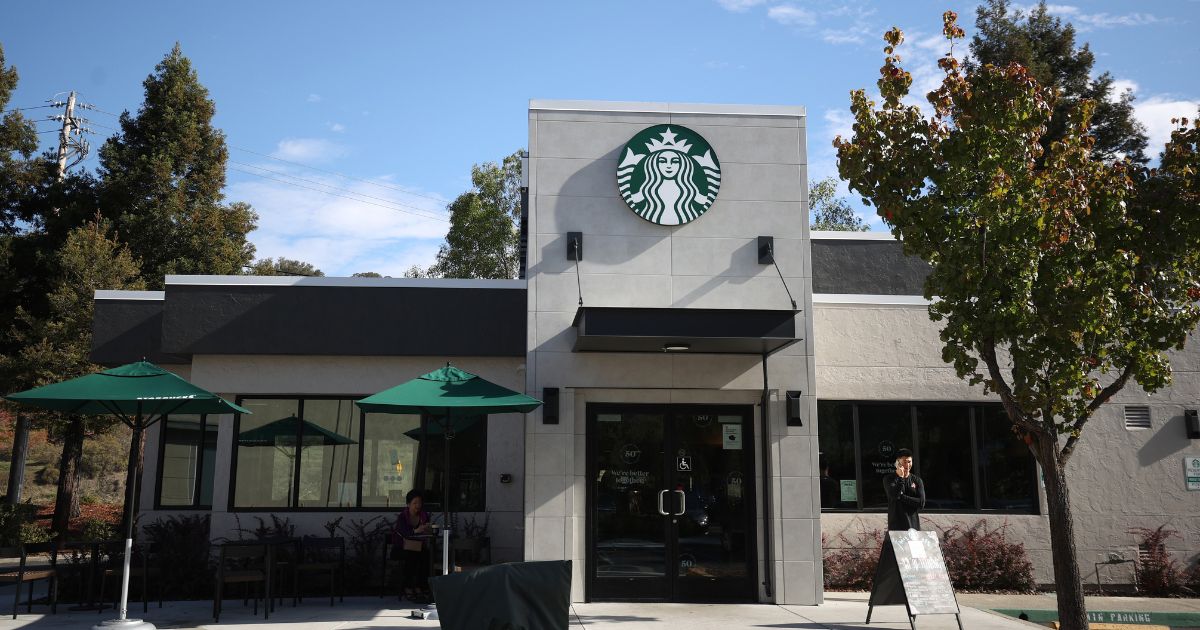 The logo for Starbucks is displayed outside a store located in Novato, California.