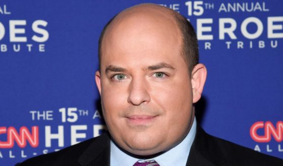 CNN host Brian Stelter poses during a network event at the American Museum of Natural History in New York on Dec. 12, 2021.
