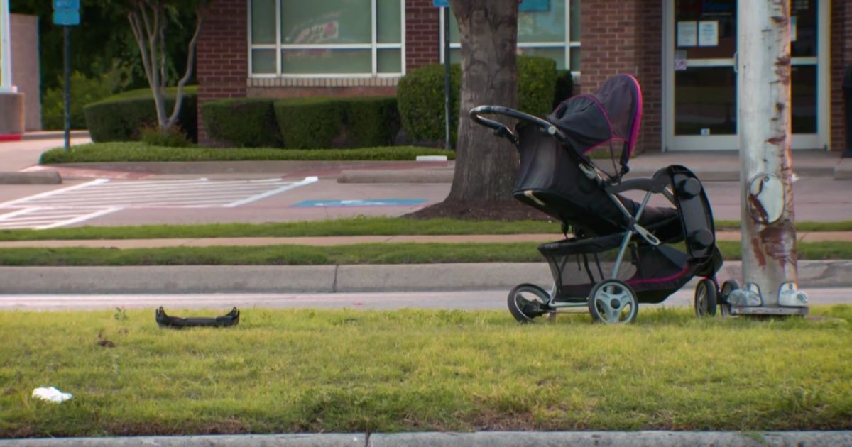 A stroller sits abandoned on the side of a street in Fort Worth, Texas, after three children and one woman were hit by a vehicle on Sunday.