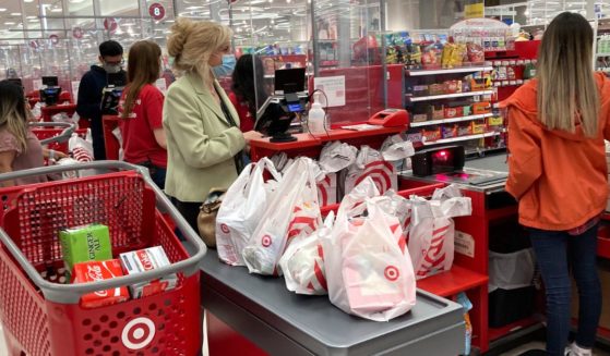 A customer waits to get a receipt at a register in Target