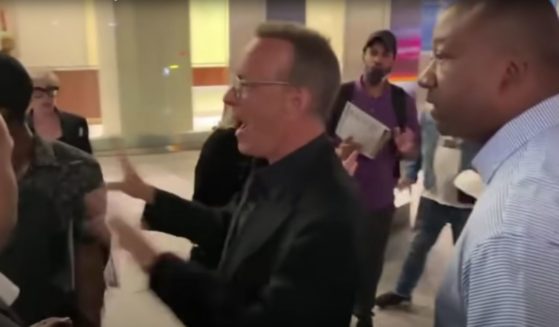 Actor Tom Hanks yells at a crowd after they nearly caused his wife to fall.
