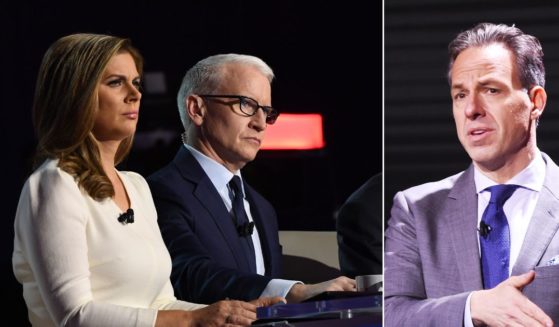 CNN anchors Erin Burnett, left, Anderson Cooper and Jake Tapper, right.