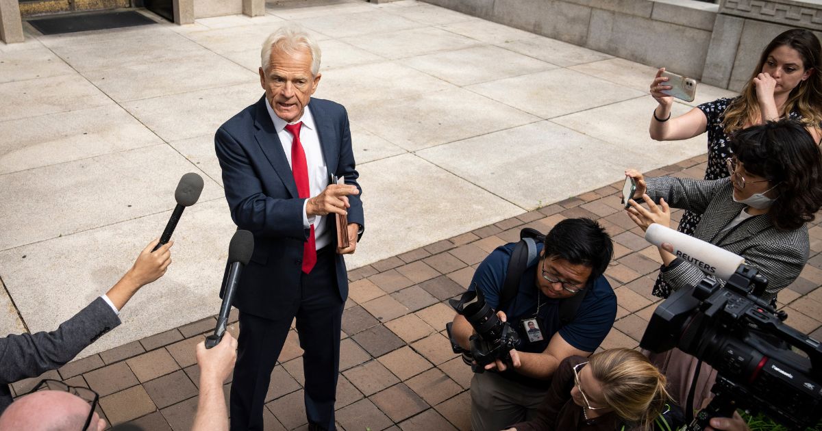 Former Trump White House adviser Peter Navarro talks to reporters after being released without bail from federal court after his arrest Friday at a Washington-area airport.
