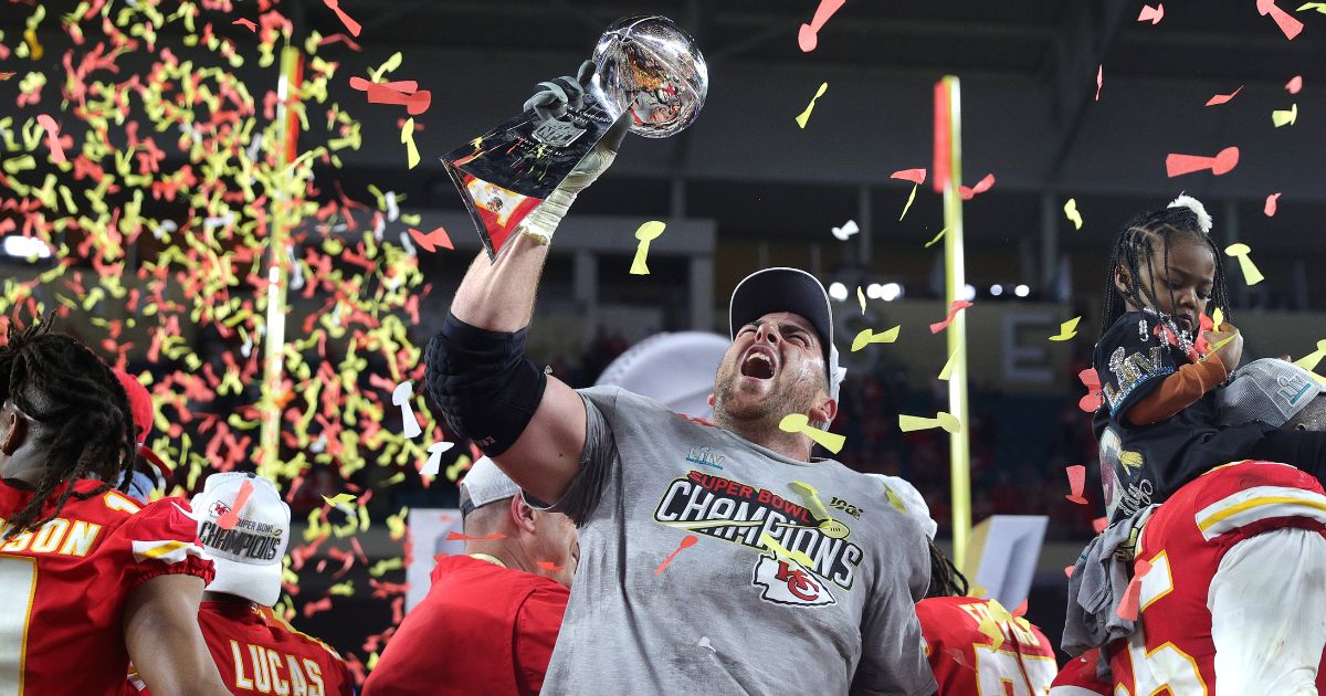 Laurent Duvernay-Tardif of the Kansas City Chiefs raises the Vince Lombardi Trophy after the Chiefs defeated the San Francisco 49ers in Super Bowl LIV in Miami on Feb. 2, 2020.