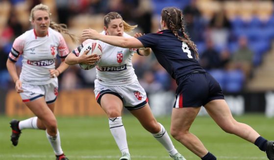 Emily Rudge of England is challenged by Laureane Biville of France during the Women's International Friendly match between England and France on Saturday in Warrington, England.