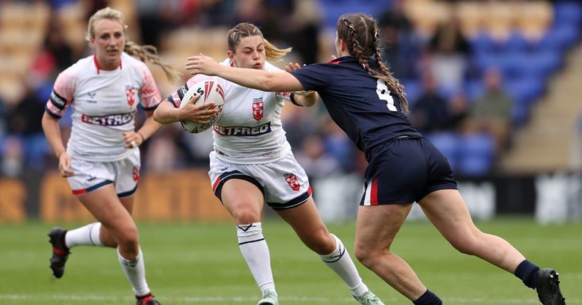 Emily Rudge of England is challenged by Laureane Biville of France during the Women's International Friendly match between England and France on Saturday in Warrington, England.