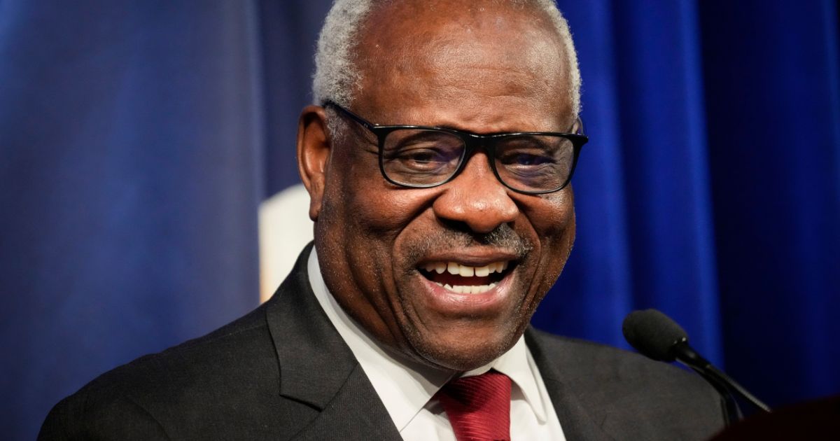 Supreme Court Justice Clarence Thomas, pictured grinning at a Heritage Foundation event in October.