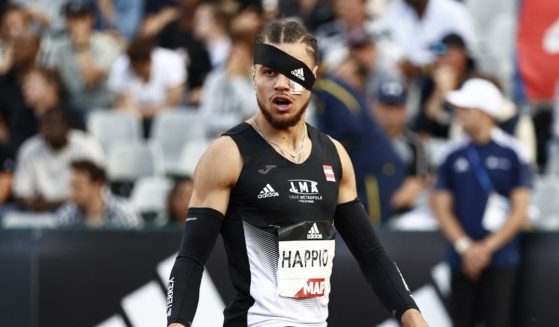 French runner Wilfried Happio wears a bandage after being assaulted at the warm-up stage during in the men's 400 meter hurdles final during the French Elite Athletics Championships at the Helitas stadium in Caen, in northern France.